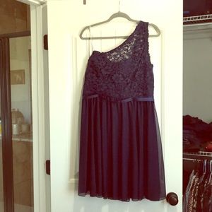 Cocktail length dress for a formal occasion.